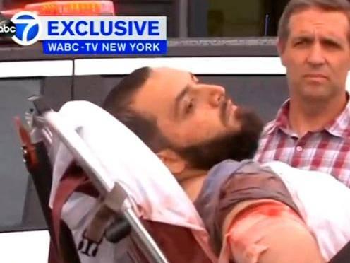 Ahmad Khan Rahami being taken into an ambulance after a shoot-out with police in Linden New Jersey in a still captured from a TV video