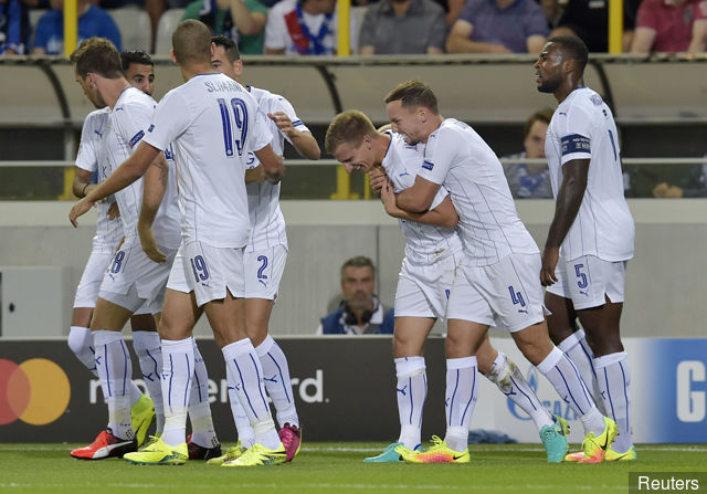 Leicester City's Marc Albrighton celebrates with team mates after scoring their first goal