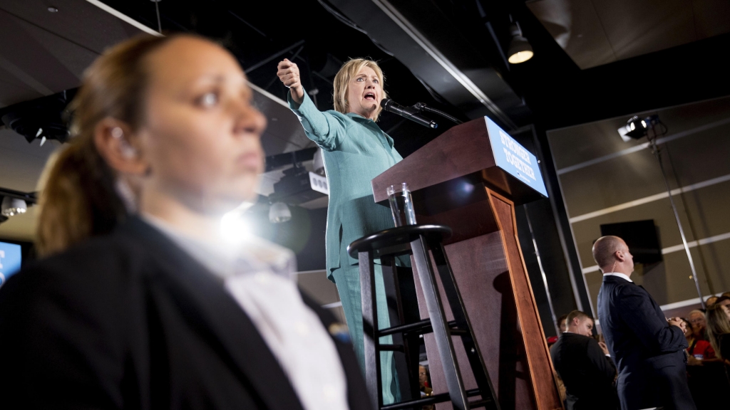 Members of the Secret Service stand guard near Democratic presidential candidate Hillary Clinton in August as she speaks at a rally at International Brotherhood of Electrical Workers Local 357 Hall in Las Vegas