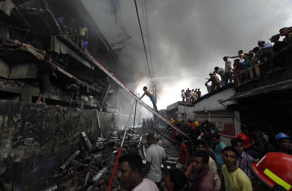 BANGLADESH DHAKA- SEPTEMBER 2016 Firefighters attempt to extinguish a fire at a garment packaging factory in the Tongi industrial area