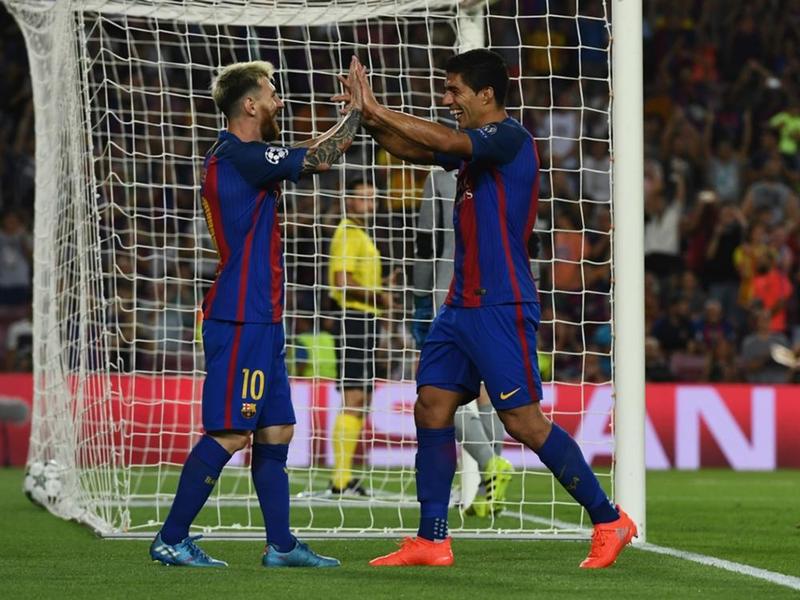 Lionel Messi and Luis Suarez celebrate against Celtic