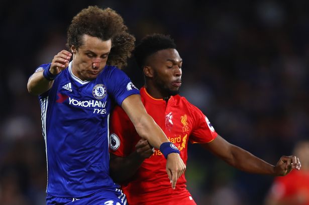 Liverpool FC's Daniel Sturridge and David Luiz of Chelsea battle for possession during the Premier League match at Stamford Bridge