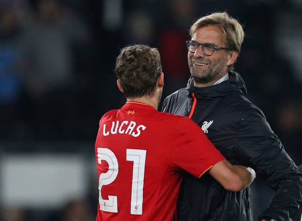 Liverpool manager Jurgen Klopp embraces Lucas Leiva after the League Cup win over Derby on Tuesday night