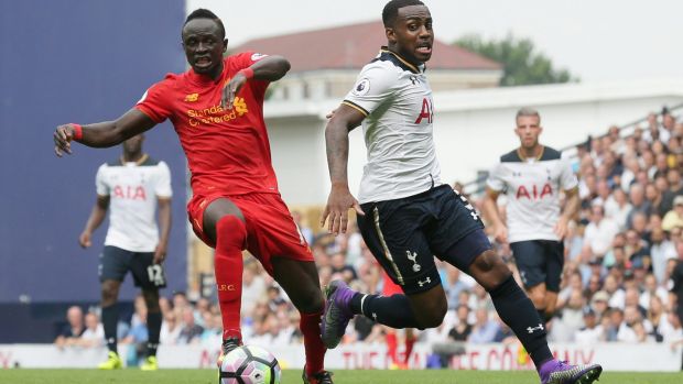 Liverpool's Sadio Mane competes for the ball with Tottenham's Danny Rose