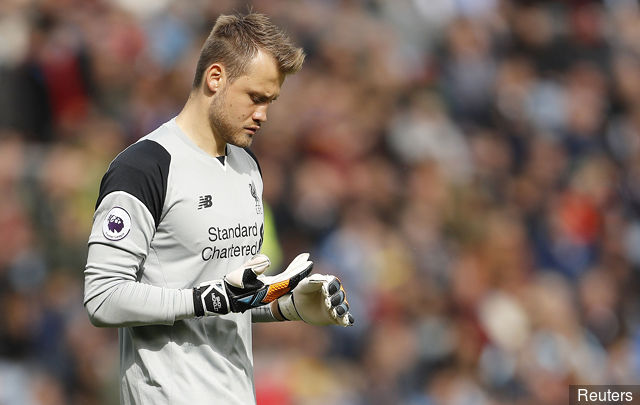 Liverpool's Simon Mignolet looks dejected after conceding a goal