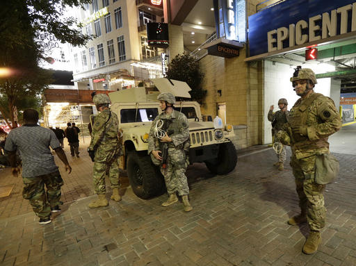 National Guardsman stand on the street in downtown Charlotte N.C. on Thursday Sept. 22 2016. Charlotte police refused under mounting pressure Thursday to release video that could resolve wildly different accounts of the shooting of a black man as the