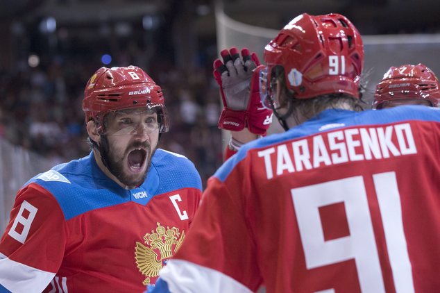 Team Russia's Alex Ovechkin left reacts as he celebrates with goal-scorer Vladimir Tarasenko after their first goal against Finland during the second perio