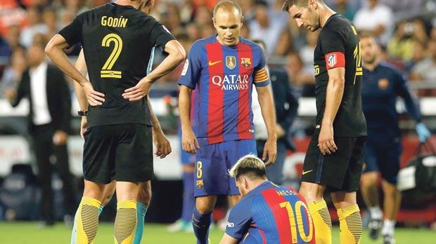 Barcelona’s Lionel Messi grounded with injury at the Nou Camp on Wednesday