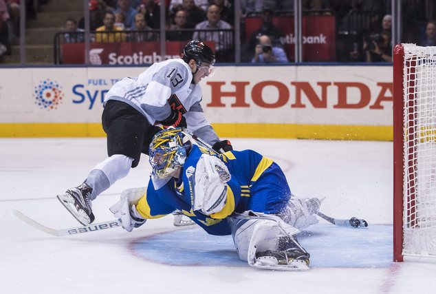 North America's Johnny Gaudreau scores past Sweden's goalie Henrik Lundqvist during the first period of a World Cup of Hockey game in Toronto Wednesday Sep