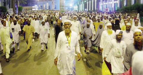 MAKKAH Muslim pilgrims walk out after the last prayer of the day leaving the Grand Mosque on Wednesday. — AFP