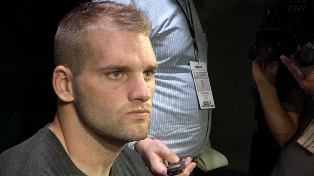 MSU senior quarterback Tyler O'Connor talks to the media after the Spartans fall to Wisconsin 30 to 6 on Saturday afternoon