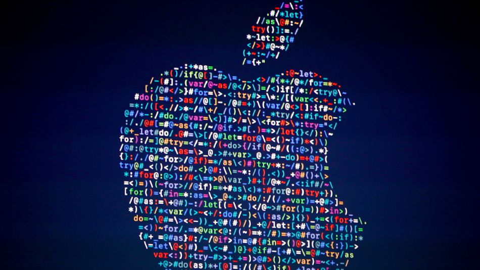 The Apple logo is shown on a screen at the Apple Worldwide Developers Conference in the Bill Graham Civic Auditorium San Francisco Monday