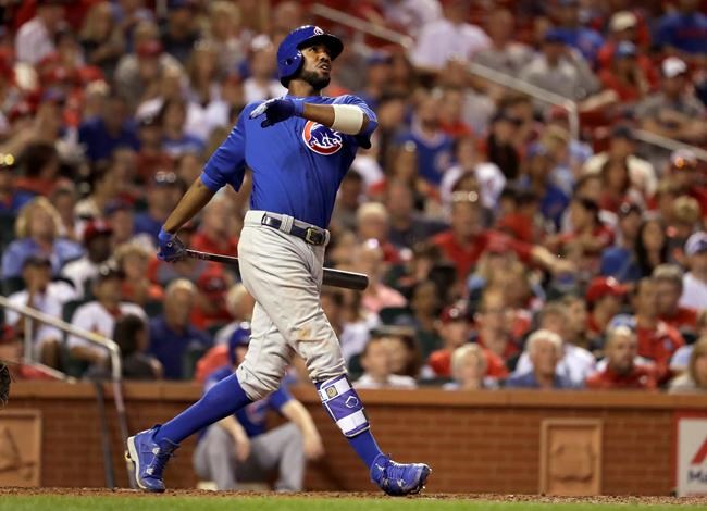 Chicago Cubs&#39 Dexter Fowler watches his two-run home run during the fifth inning of a baseball game against the St. Louis Cardinals Monday Sept. 12 2016 in St. Louis