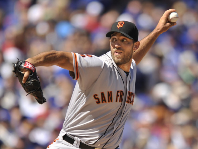 Madison Bumgarner and Jake Arrieta each allowed two earned runs in six innings and threw 103 pitches Saturday at Wrigley Field. | Paul Beaty  AP