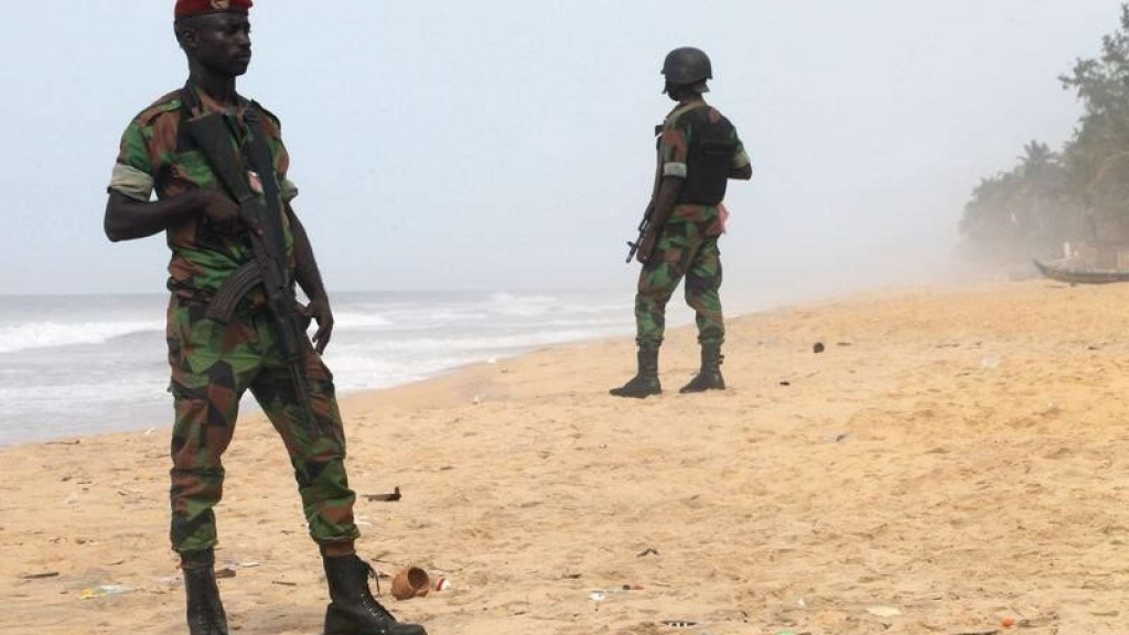 Soldiers stand guard on the beach following an attack by gunmen from al Qaeda's North African branch in Grand Bassam Ivory Coast