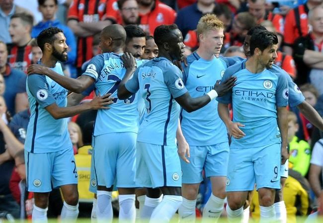 Manchester City's Kevin De Bruyne third-right celebrates with teammates after scoring during the English Premier League soccer match between Manchester City and Bournemouth at the Etihad Stadium in Manchester England Saturday Sept. 17 2016. (AP