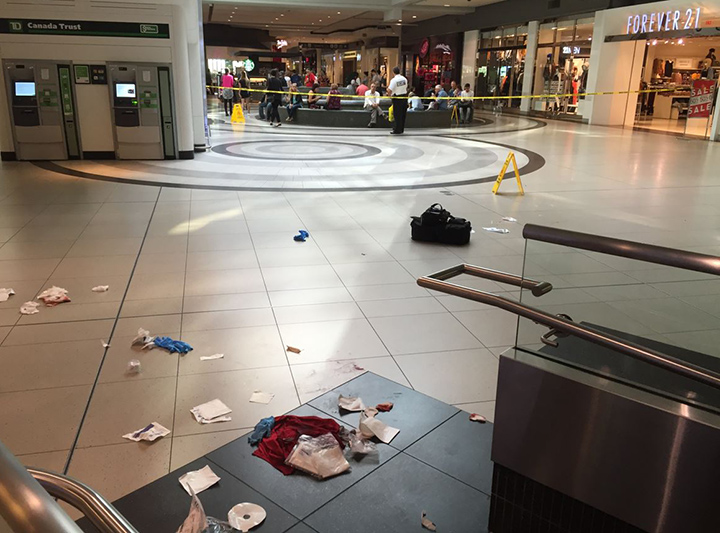 A man has been rushed to hospital after being stabbed multiple times inside the Eaton Centre