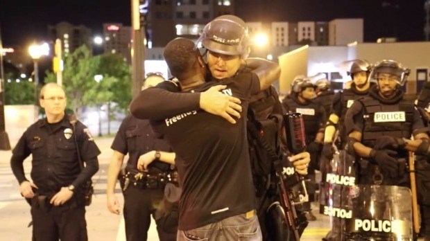 Man gives free hugs during Charlotte protests