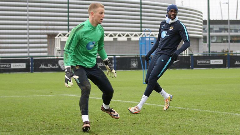 Manchester City goalkeeper Joe Hart and Manchester City's Yaya Toure during a training session