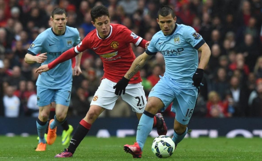 Manchester City's Argentinean striker Sergio Aguero vies with Manchester United's Spanish midfielder Ander Herrera. File