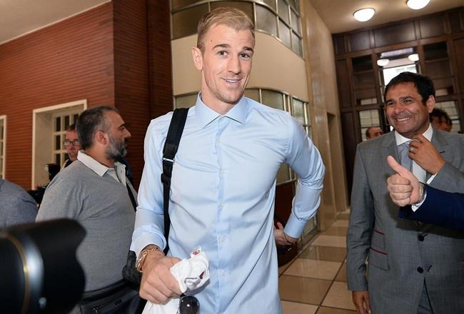 Goalkeeper Joe Hart smiles upon his arrival at the Torino soccer team headquarters in Turin Italy Tuesday Aug. 30 2016. England goalkeeper Joe Hart is on the verge of completing a loan move to Torino from Manchester City. The 29-year-old was greeted