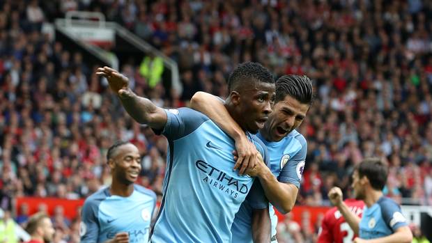 Manchester City's Kelechi Iheanacho celebrates scoring his side's second goal of the game with team-mate Nolito