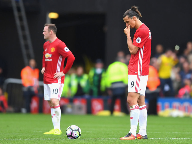 Wayne Rooney and Zlatan Ibrahimovic look on from the centre spot