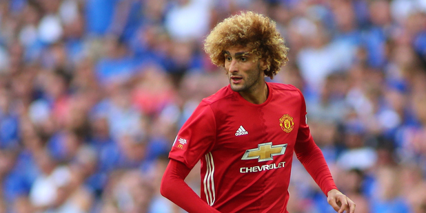 Manchester United midfielder Marouane Fellaini has been praised for helping a supporter in distress during a game against Hull City on the weekend