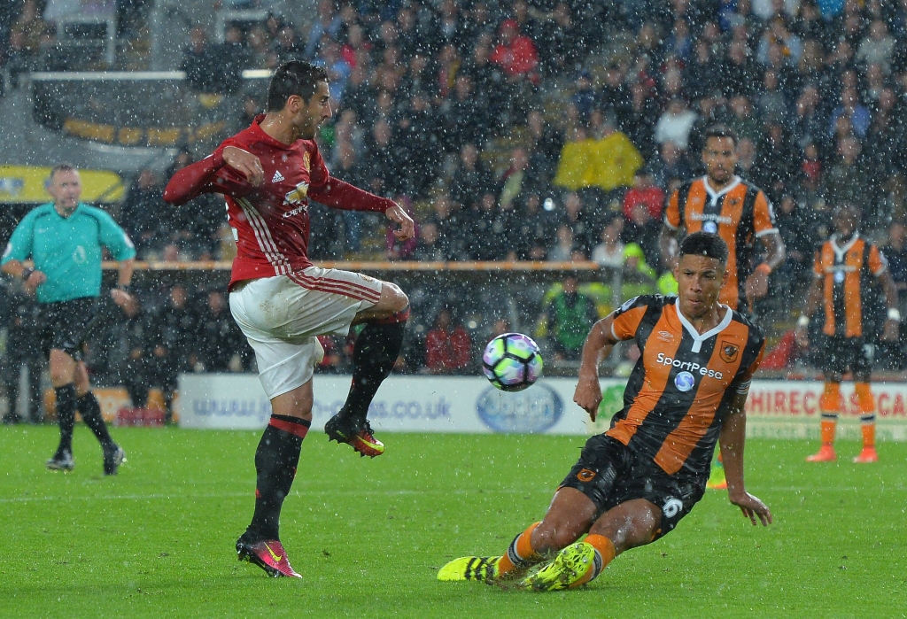 HULL ENGLAND- AUGUST 27 Henrikh Mkhitaryan of Manchester United has his shot blocked by Curtis Davis of Hull City during the Premier League match between Manchester United FC and Hull City FC at KC Stadium