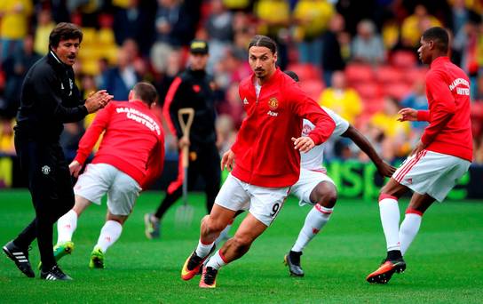 Manchester United warm up- but they don't do much running when the whistle blows