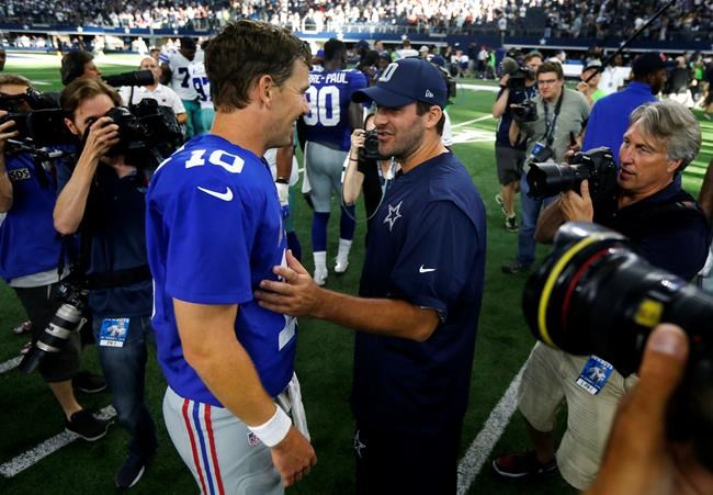 New York Giants quarterback Eli Manning talks with Dallas Cowboys quarterback Tony Romo right after the Giants 20-19 win over the Cowboys in an NFL football game Sunday Sept. 11 2016 in Arlington Texas