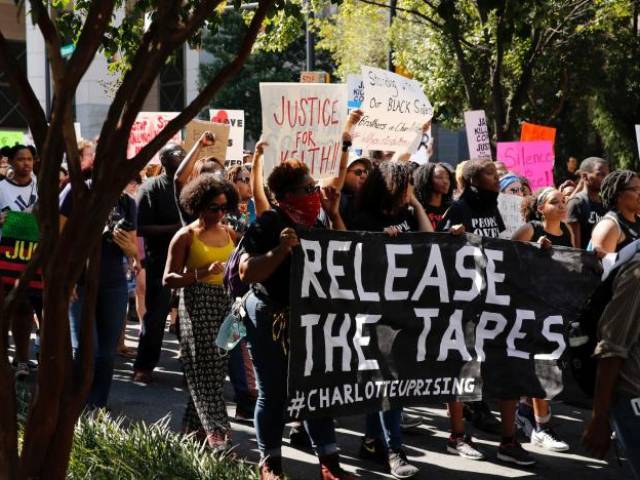 Marchers protest the police shooting of Keith Scott in Charlotte North Carolina U.S. September 24 2016