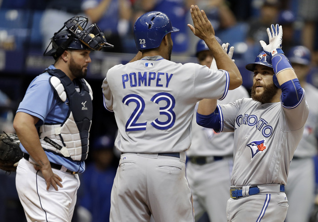 Toronto Blue Jays Russell Martin right celebrates with Dalton Pompey after hitting a two-run home run off Tampa Bay Rays relief pitcher Kevin Jepsen durin