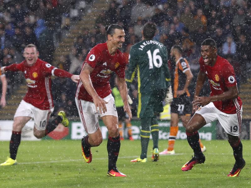 Marcus Rashford wheels away in celebration as Zlatan Ibrahimovic and Wayne Rooney join him