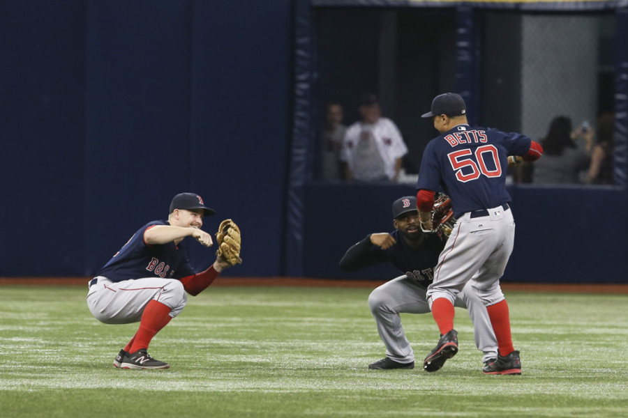 23 September 2016 Boston Red Sox third baseman Brock Holt, Boston Red Sox center fielder Jackie Bradley Jr. and Boston Red Sox right fielder Mookie Betts celebrate after the Major League Baseball game between the Boston Red Sox and Tampa