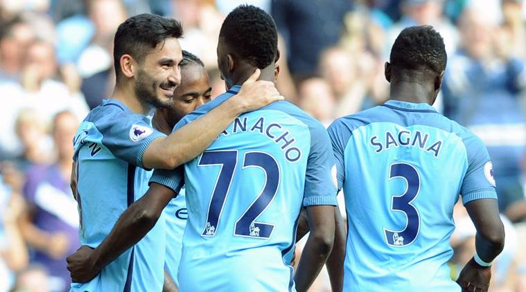 Manchester City's Ilkay Gundogan left celebrates with teammates after scoring during the English Premier League soccer match between Manchester City and Bournemouth at the Etihad Stadium in Manchester England Saturday Sept. 17 2016. (AP