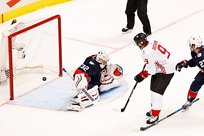 Matt Duchene of Team Canada scores a first-period goal past Jonathan Quick of Team USA during the World Cup of Hockey in Toronto Canada.- AFP