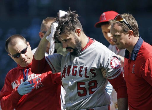 Los Angeles Angels starting pitcher Matt Shoemaker is assisted off the field after being hit by a line drive from Seattle Mariners Kyle Seager in the second inning of a baseball game Sunday Sept. 4 2016 in Seattle