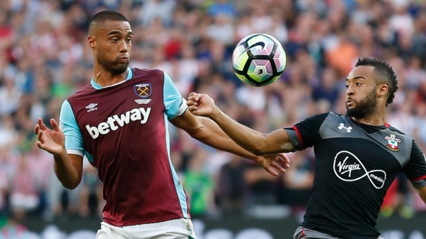 West Ham defender Winston Reid challenges Southampton's Nathan Redmond