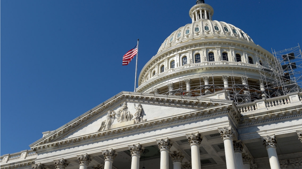 An American flag flies over Capitol Hill in Washington Tuesday Sept. 6 2016 as lawmakers return from a 7-week break. Election-year politics will rule the congressional calendar when lawmakers return from a seven-week recess. Congress will have a littl