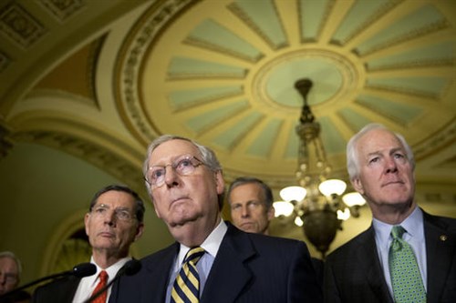 Senate Majority Leader Mitch Mc Connell of Ky. accompanied by from left Sen. John Barrasso R-Wyo. Sen. John Thune R-S.D. and Senate Majority Whip John Cornyn of Texas listen to a question during a news conference on Capitol Hill recently in Washing