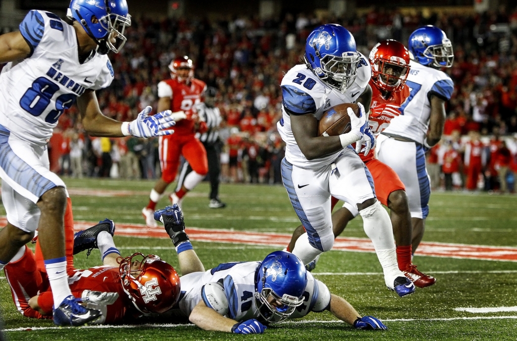 Memphis running back Doroland Dorceus scrambles for a 61-yard touchdown pass against the Houston defense during second quarter action at TDECU Stadium in Houston Texas