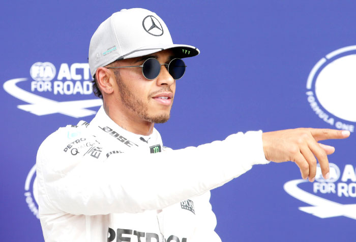 Mercedes’ driver Lewis Hamilton celebrates qualifying in pole position for the Italian Grand Prix at the Autodromo Nazionale Monza Saturday. — Reuters