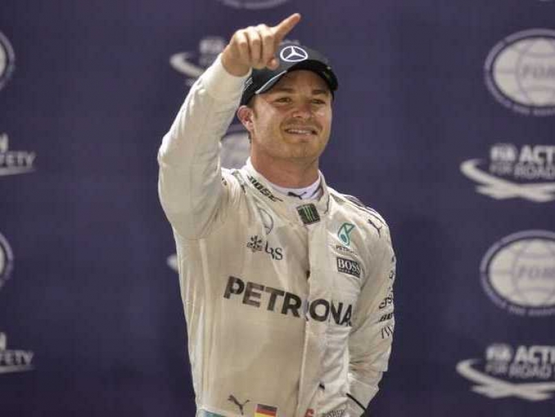 Mercedes driver Nico Rosberg gestures as he celebrates pole position for the Singapore Grand Prix