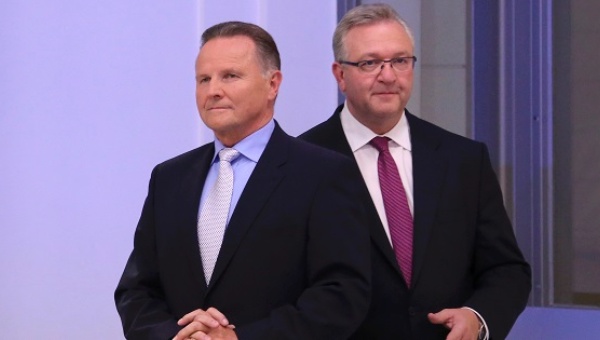 CDU top candidate Frank Henkel walks past AfD top candidate Georg Pazderski in a TV studio at the Berlin state assembly Germany