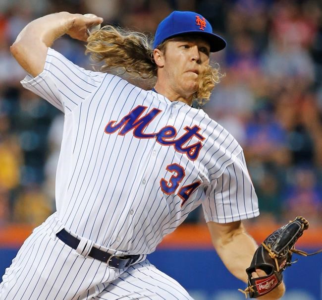 New York Mets starting pitcher Noah Syndergaard delivers during the first inning of a baseball game against the Philadelphia Phillies Saturday Aug. 27 2016 in New York