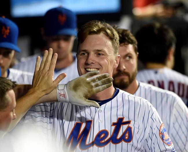 New York Mets Jay Bruce celebrates his solo home run off of Miami Marlins starting pitcher Jose Urena in the dugout with teammates in the sixth inning of a baseball game Thursday Sept. 1 2016 in New York