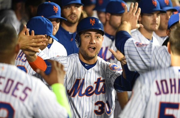 New York Mets rightfielder Michael Conforto is greeted