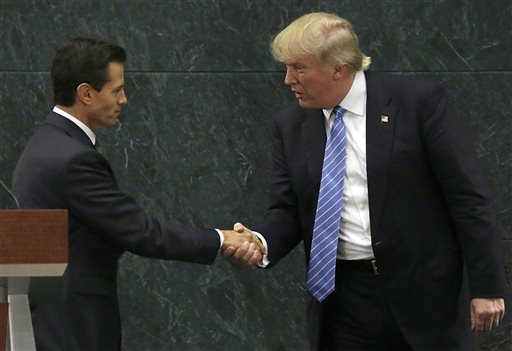 Mexico President Enrique Pena Nieto and Republican presidential nominee Donald Trump shake hands after a joint statement at Los Pinos the presidential official residence in Mexico City Wednesday Aug. 31 2016. Trump is call