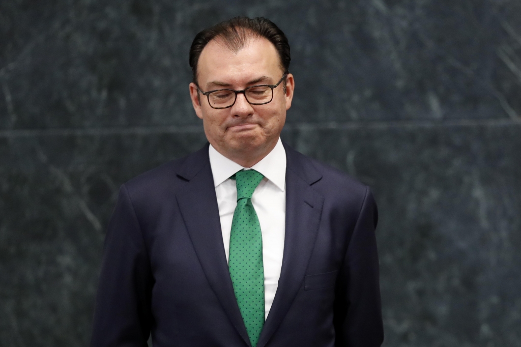 Mexico’s Finance Secretary Luis Videgaray looks down as President Enrique Pena Nieto announces Videgaray’s resignation at Los Pinos presidential residence in Mexico City on Wednesday Sept. 7 2016. The Treasury Ministry gave no reason for the resigna